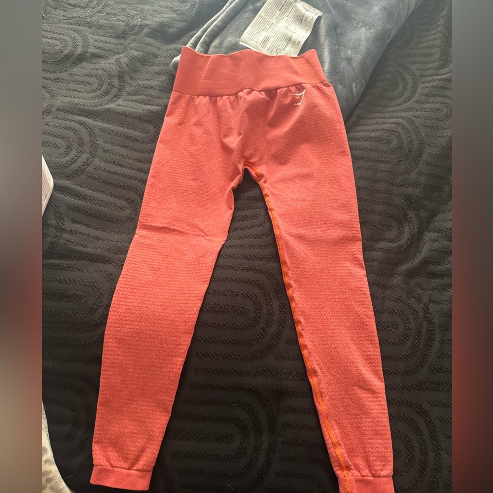 gymshark orange leggings 
waist-13”
length-24”